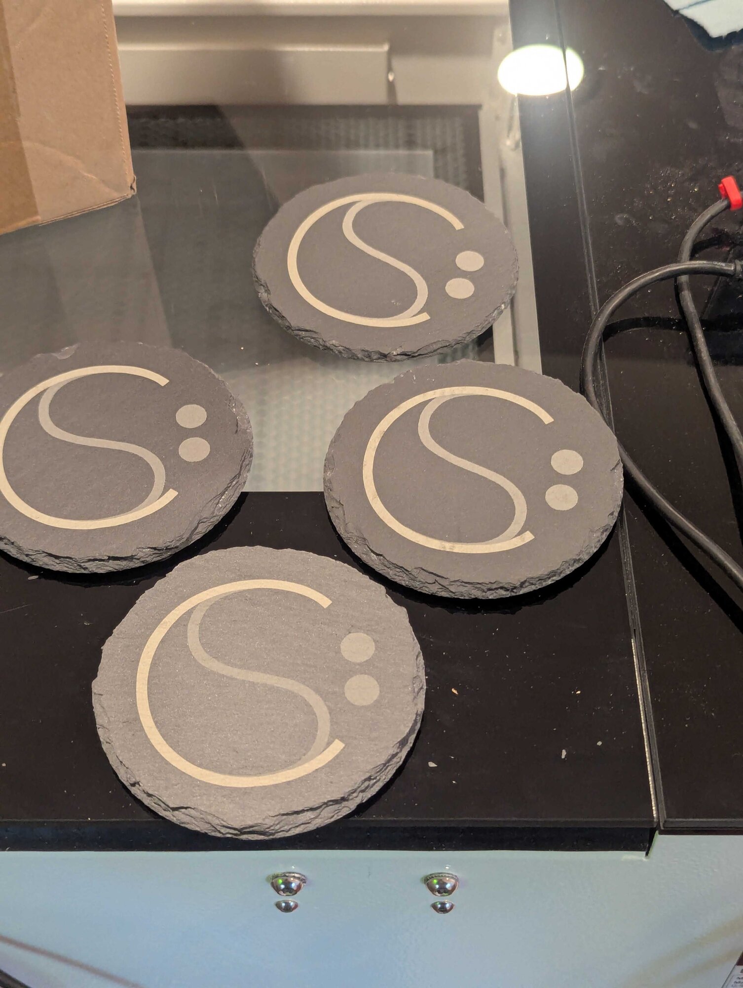 ./coasters-on-laser.jpg ./coasters-on-laser.jpg